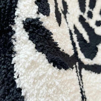 Textura felpuda em preto e branco do tapete bumbum